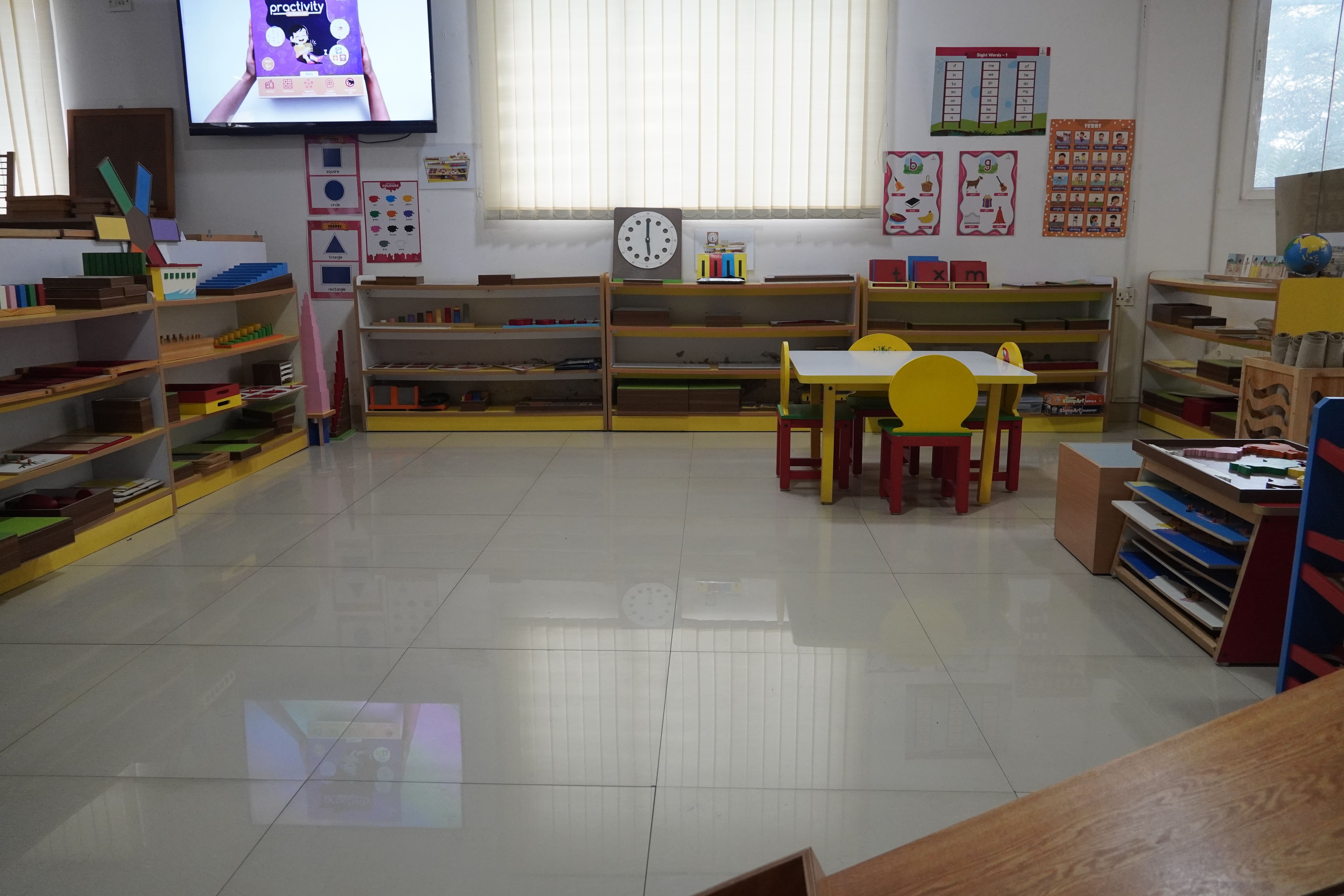 Bright, orderly Montessori classroom with wooden materials
