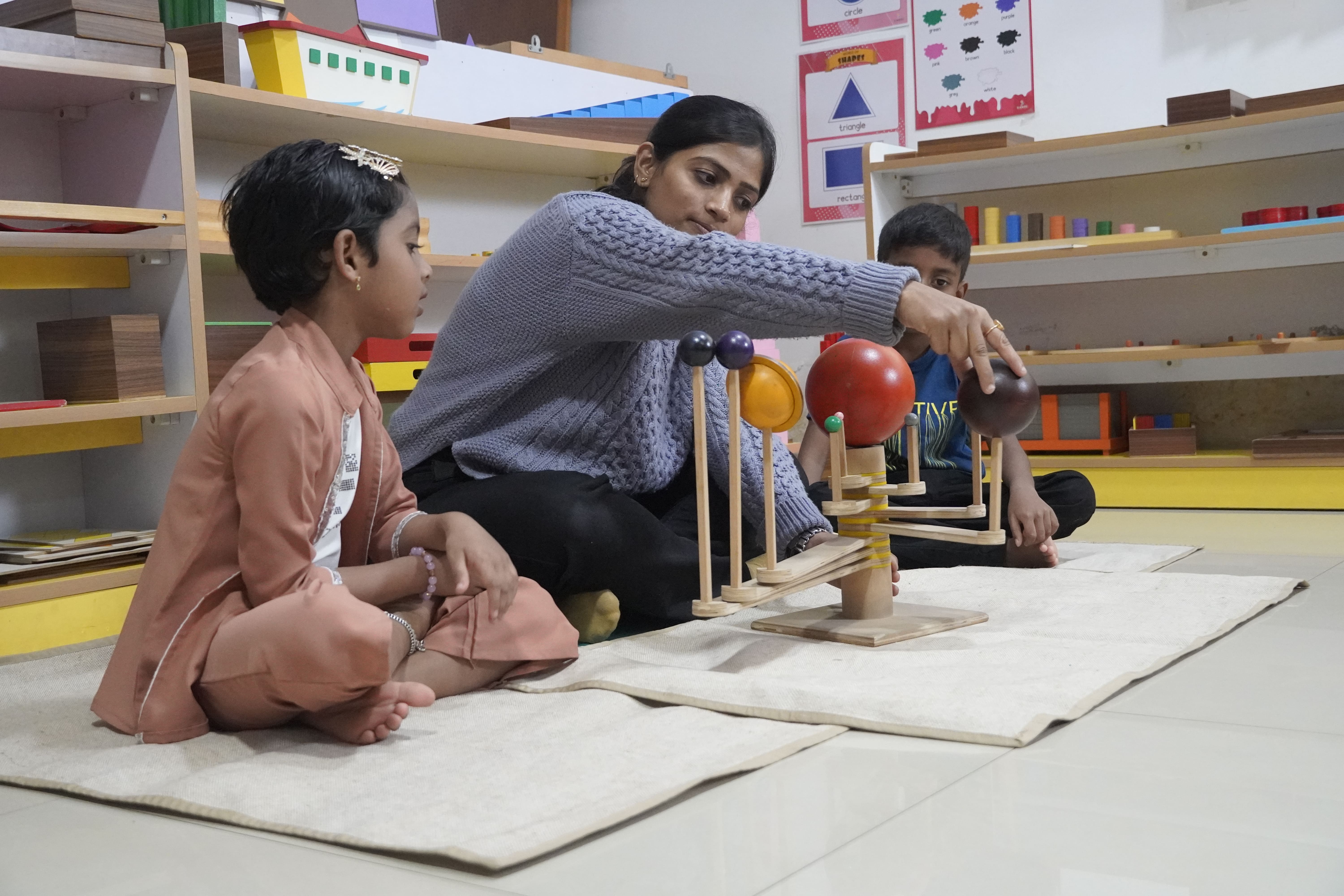 Happy children engaging in a Montessori activity in a bright classroom