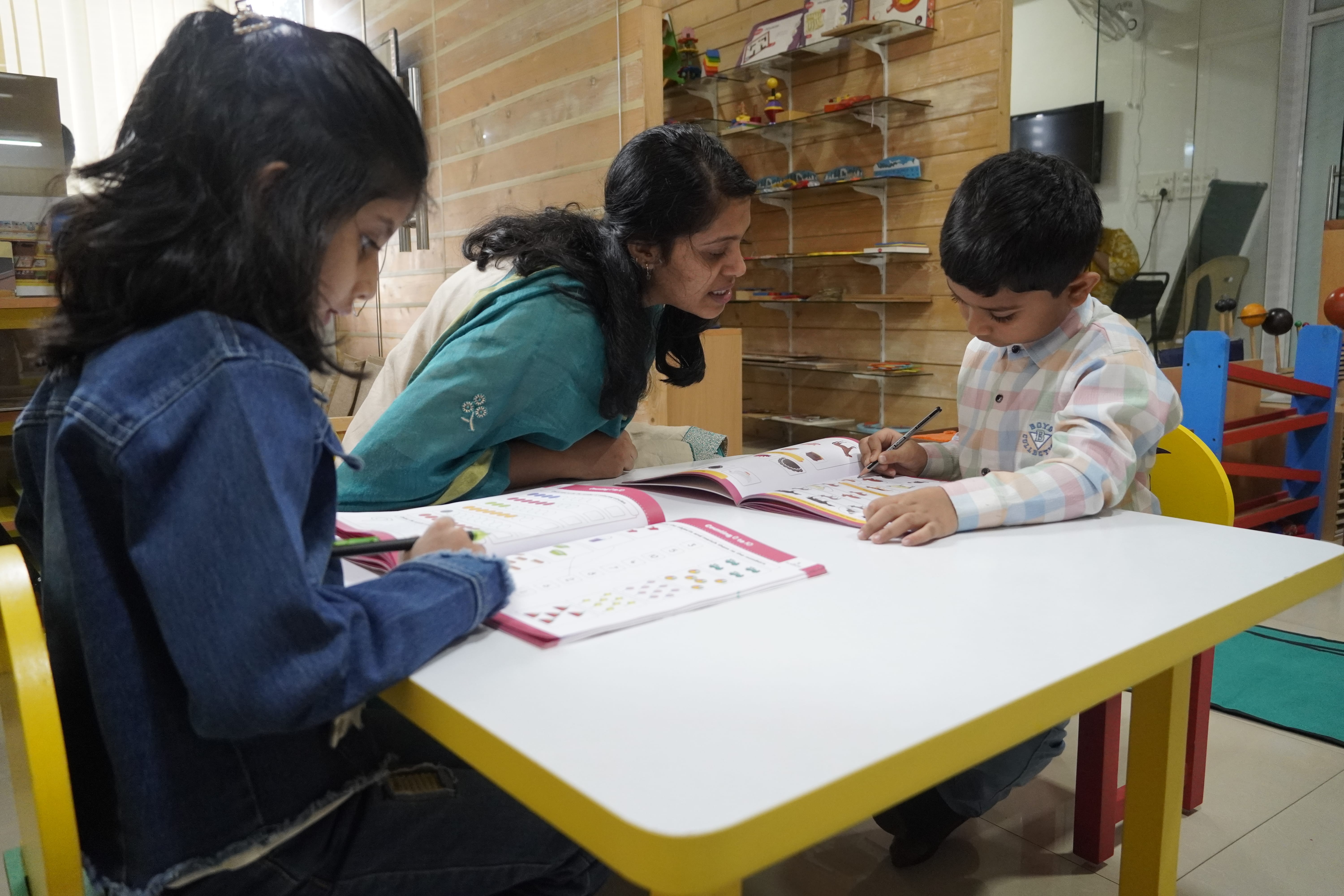 Child working intently with Montessori materials