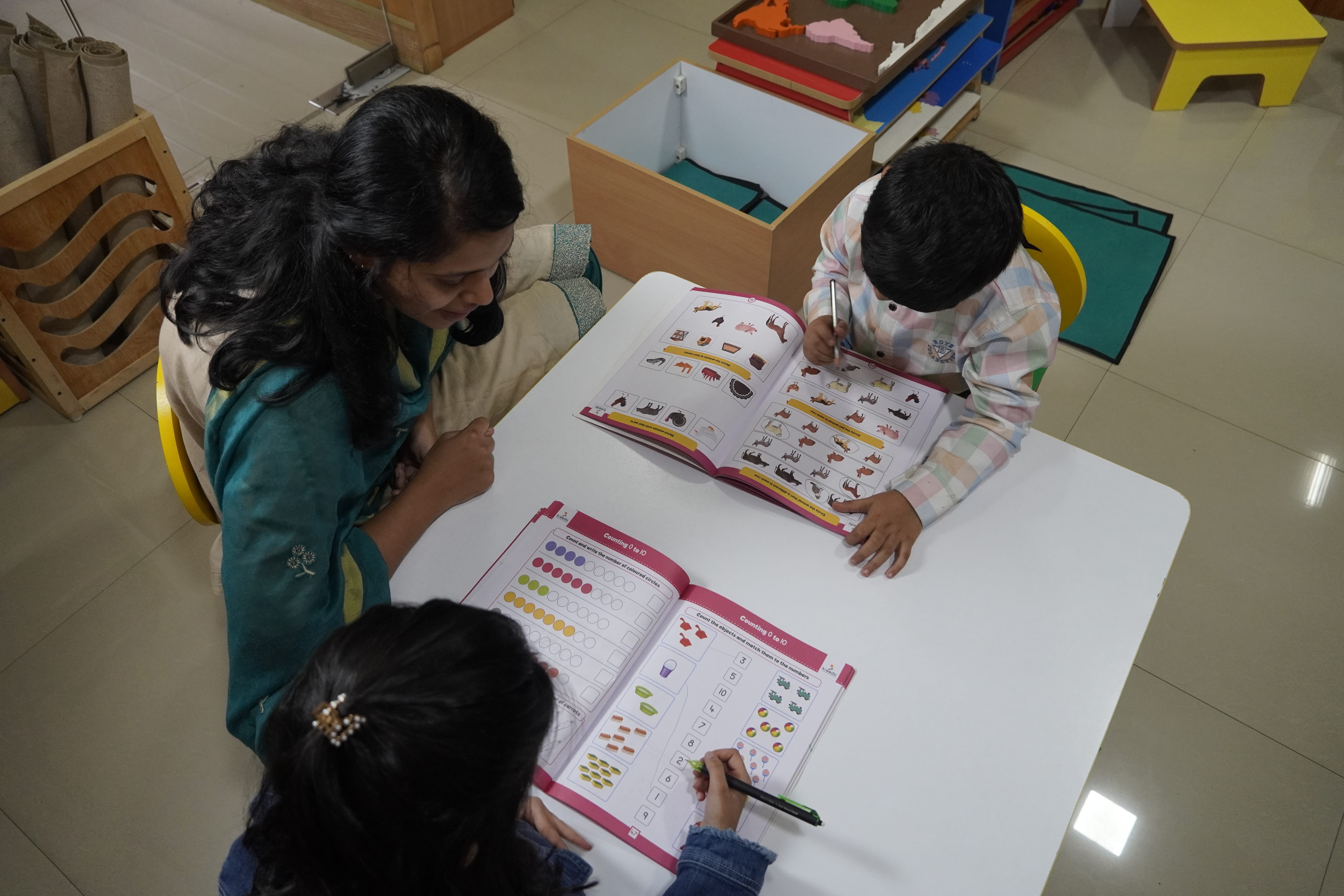 A child focused on a practical life exercise